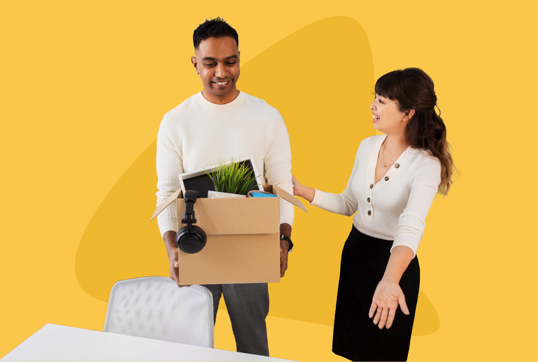 Woman showing a man to his work desk.