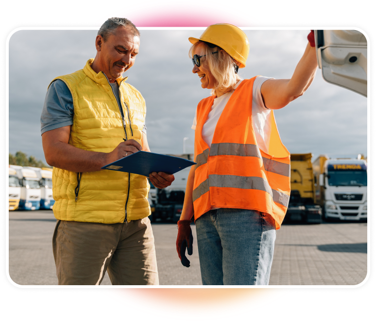 Man conducting an on-site visit with a female truck supervisor.