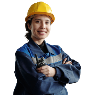 Woman in construction uniform smiling at camera.