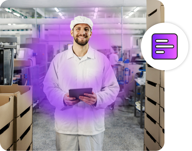 Man smiling, wearing a white uniform in a factory.